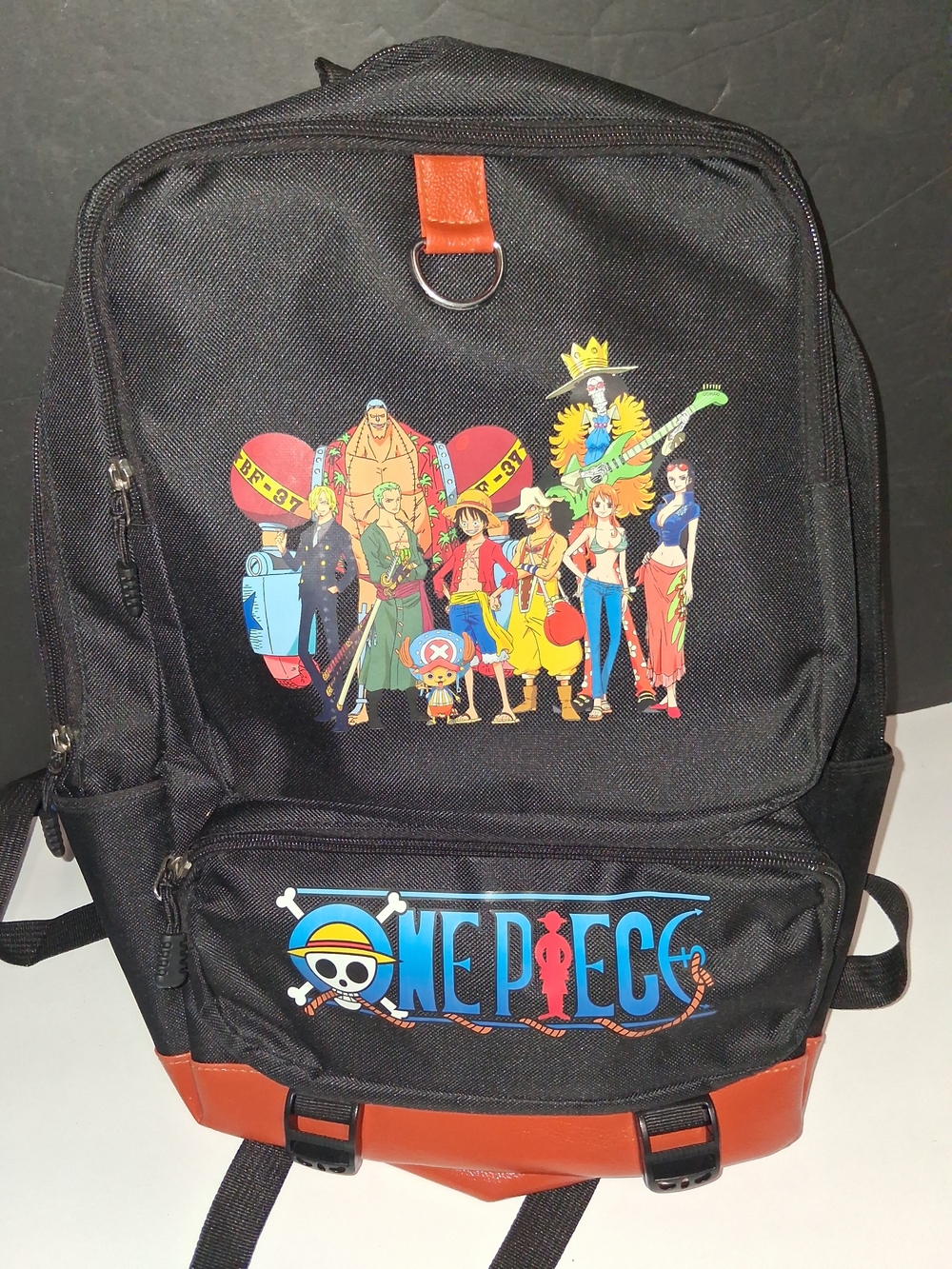 Onepiece Black Backpack with Brown Trim and Colorful Crew Print